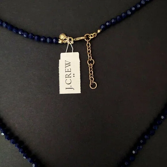 Navy beaded necklace with florescent orange thread tassel - Picture 8 of 12